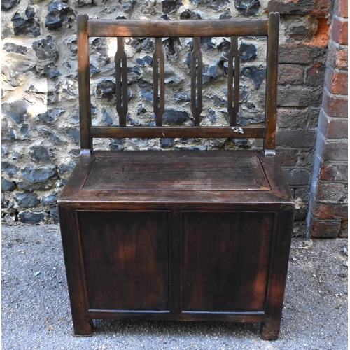 106 - A Chinese Qing dynasty seat, 19th century, probably hongmu wood, with privacy compartment under the ... 