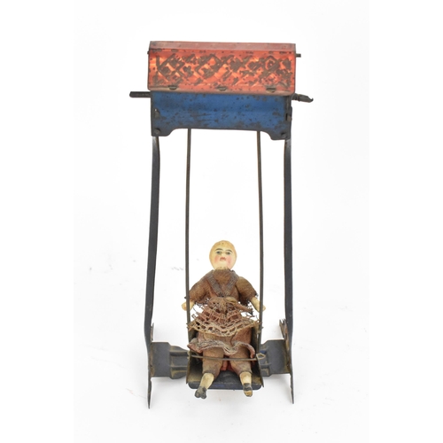 219 - A late Victorian miniature doll on swing toy by Ernst Paul Lehmann, circa 1894-1899, the porcelain h... 