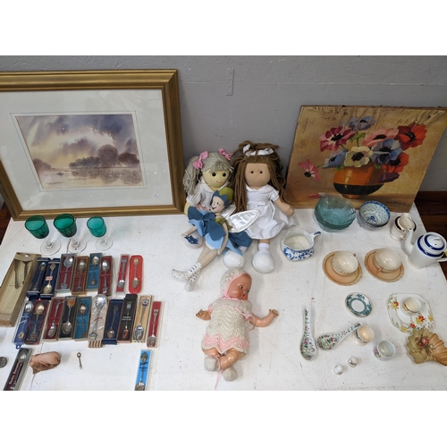 312 - Pictures, dolls, ceramics, glass and collectables to include commemorative spoons, green glass glass... 