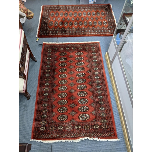 315 - Two similar Bokhara rugs with repeating gulls on a red background, 150cm x 96cm
Location:A4B