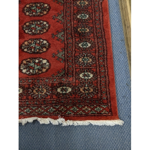 315 - Two similar Bokhara rugs with repeating gulls on a red background, 150cm x 96cm
Location:A4B