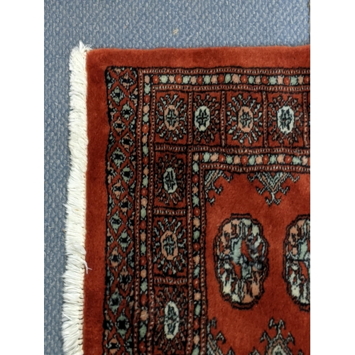 315 - Two similar Bokhara rugs with repeating gulls on a red background, 150cm x 96cm
Location:A4B