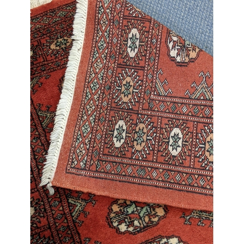 315 - Two similar Bokhara rugs with repeating gulls on a red background, 150cm x 96cm
Location:A4B