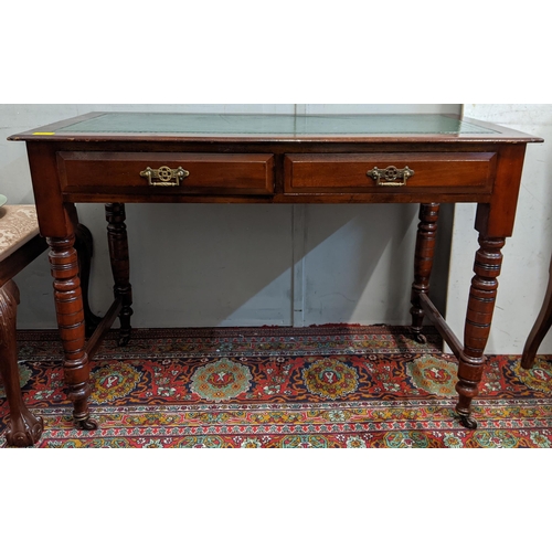 316 - An early 20th century mahogany desk with a green leather topped scriber with side stretchers, raised... 