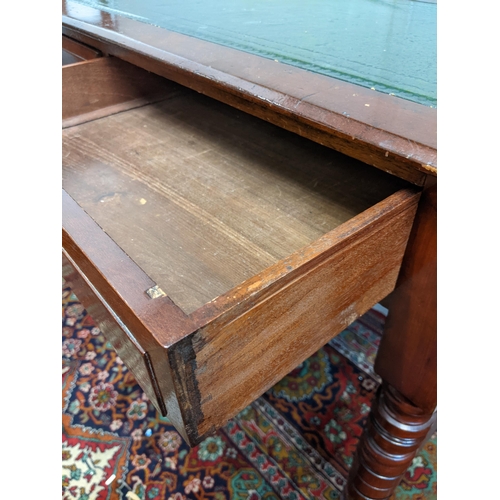 316 - An early 20th century mahogany desk with a green leather topped scriber with side stretchers, raised... 