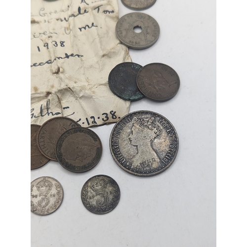 99 - A mixed collection of Victorian and later coins to include a Gothic Florin, 1887 Sixpence, and later... 