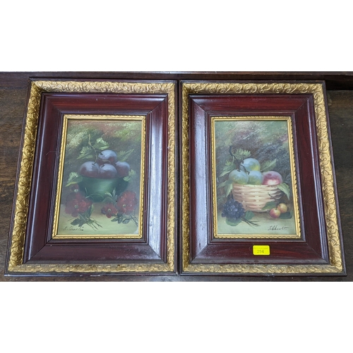 294 - A pair of oil paintings depicting still life scenes of fruit in a bowl, indistinctly signed, 29cm x ... 