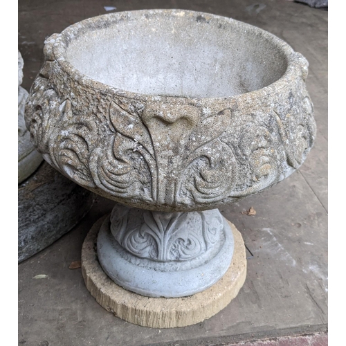 306 - A reconstituted stoneware garden planter decorated in relief and on a single pedestal, 41cm h x 41cm... 