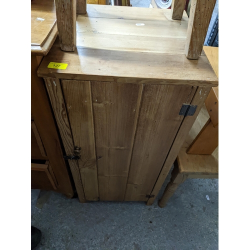 127 - A Victorian pine plank side cupboard of small proportions 77cm x 38cm x 39cm, two small pine stools,... 