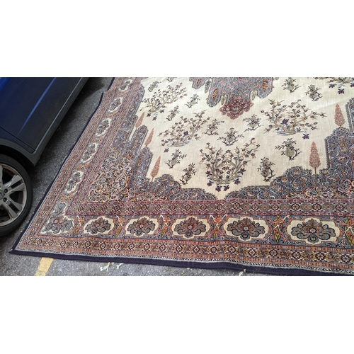 307 - A large machine woven Persian design carpet having a central medallion, beige, ground an multi guard... 