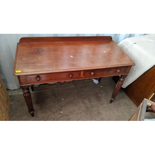 327 - A Victorian mahogany side table having two drawers and on reeded legs
Location:RED CON