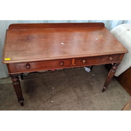 327 - A Victorian mahogany side table having two drawers and on reeded legs
Location:RED CON