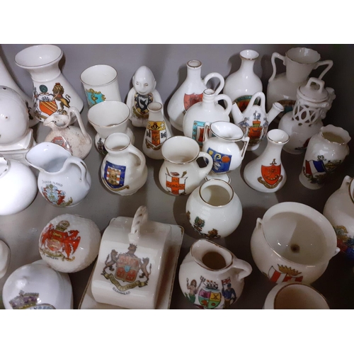 366 - A large quantity of crested china and ceramics to include Clifton, Grafton, Goss and Arcadian Locati... 