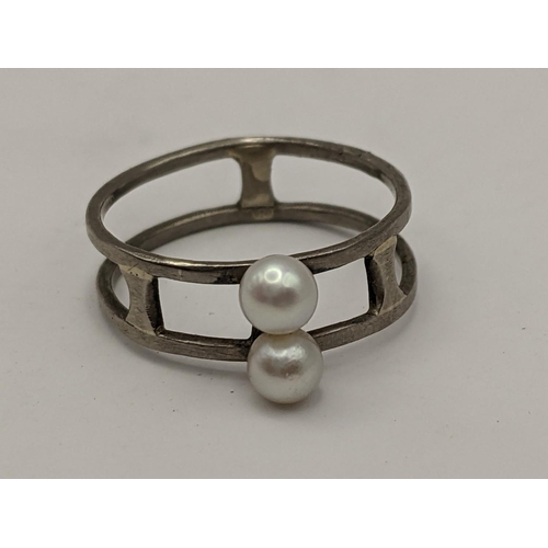 385 - A pearl and white metal ring, the shank stamped 18ct, 3g 
Location:CAB 5