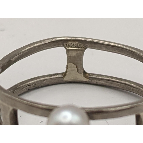 385 - A pearl and white metal ring, the shank stamped 18ct, 3g 
Location:CAB 5