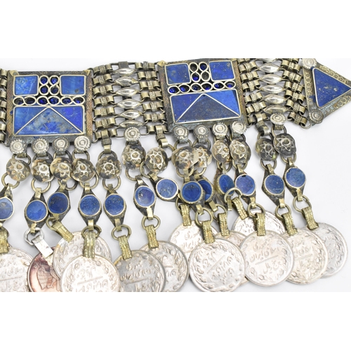 113 - A tribal Yemeni white metal and lapis lazuli belt piece, together with an Indian ladakh collar neckl... 