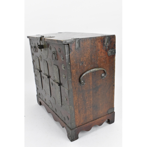 115 - A Korean iron clad table cabinet, late 19th/early 20th century, Joseon dynasty, with hinged fall fro... 