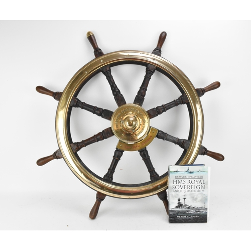 223 - A large oak and brass ships wheel removed from HMS Royal Sovereign, the brass hub reading 'Brown Bro... 