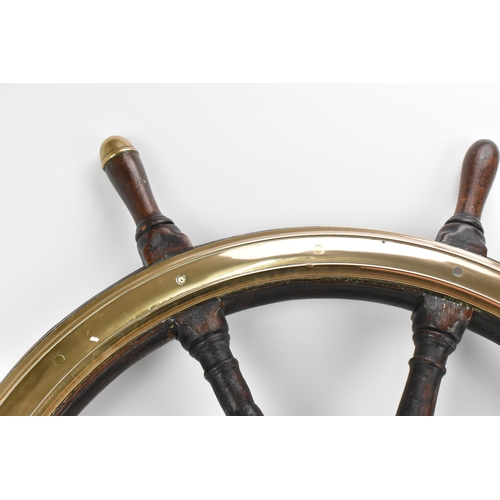 223 - A large oak and brass ships wheel removed from HMS Royal Sovereign, the brass hub reading 'Brown Bro... 