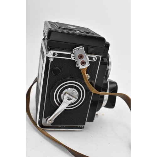 233 - A Rollei Rolleiflex 3.5F Medium Format TLR Camera, black, serial no 2805127, together with a Rollei ... 