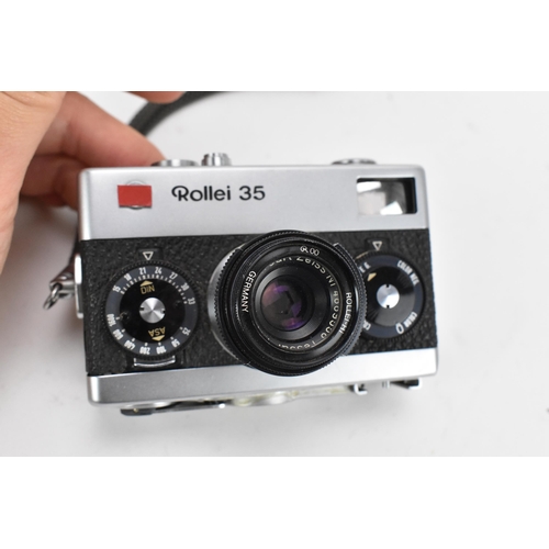 233 - A Rollei Rolleiflex 3.5F Medium Format TLR Camera, black, serial no 2805127, together with a Rollei ... 