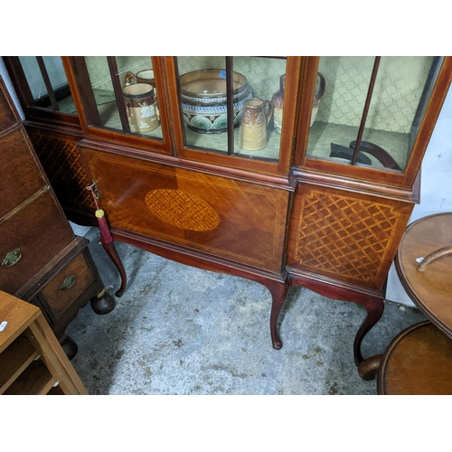 407 - Late Victorian inlaid breakfront mahogany display cabinet, broken swan neck pediment above twin arch... 