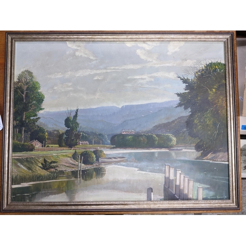 406 - Wilfred Simons - extensive river landscape with buildings, trees and a boat to the forefront, oil on... 