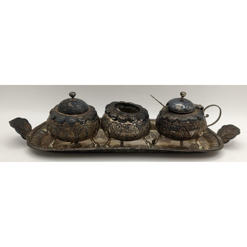 388 - A white metal South East Asian three piece condiment set on a matching tray, 170g
Location:LAB TAB