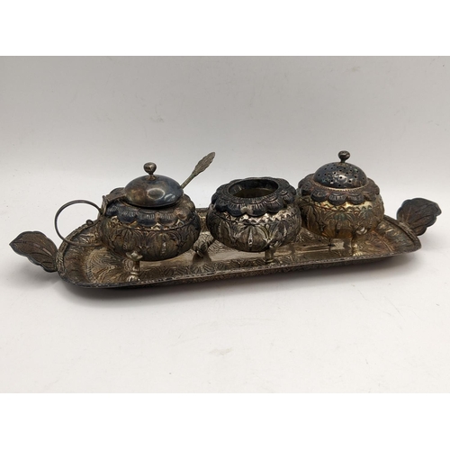 388 - A white metal South East Asian three piece condiment set on a matching tray, 170g
Location:LAB TAB