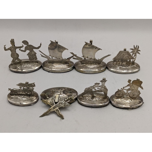 390 - A set of eight white metal South East Asian place name/menu card holders
Location:CAB