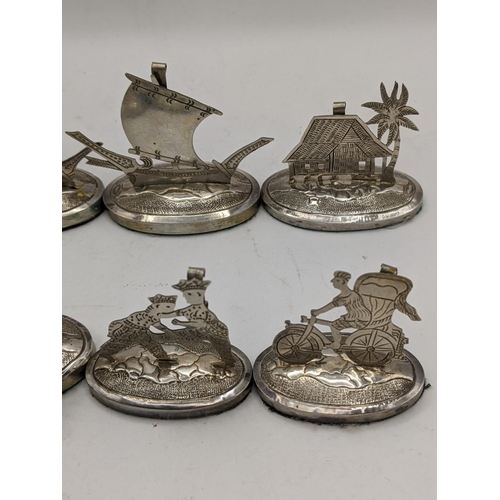 390 - A set of eight white metal South East Asian place name/menu card holders
Location:CAB