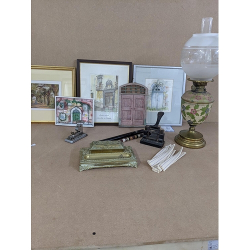 423 - A Mixed lot to include a brass inkwell stand, a brass and floral oil lamp, vintage hole punch and st... 