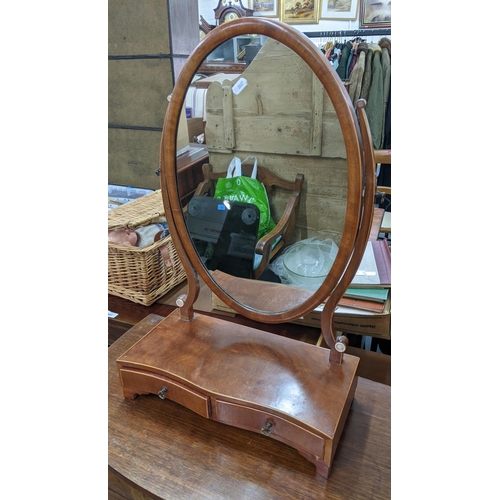 104 - An Edwardian mahogany oval dressing table mirror with short drawers below 64h x 40w
Location:A1B