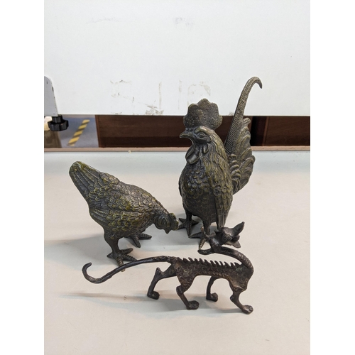 107 - Three bronze ornaments to include a cockerill together with a chicken and one other
Location:A4M