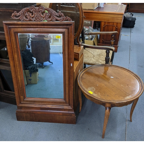 108 - A Victorian walnut mirror having a carved pediment and bevelled glass 116h x64w together with an ear... 