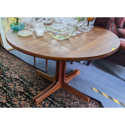 114 - A set of eight retro black vinyl and teak dinning chairs possibly by Burgess together with a teak ex... 