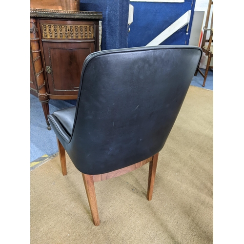 114 - A set of eight retro black vinyl and teak dinning chairs possibly by Burgess together with a teak ex... 