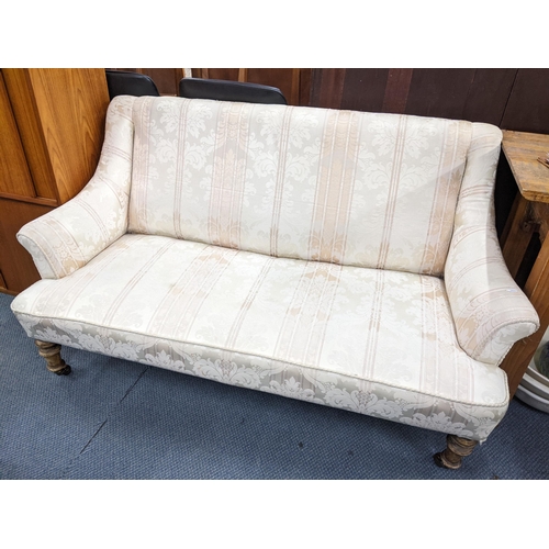 118 - A late 19th / early 20th century sofa on a grant turned legs and castors 78h x 14W
Location:A2M