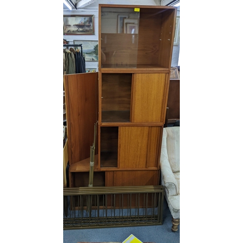 119 - A mid 20th century Staples Ladderax system consisting of  five teak cabinets, one large shelf, four ... 