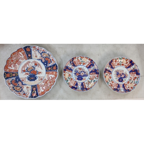 351 - A late Meiji period Japanese Imari charger, along with a pair of Japanese Imari plates A/F Location:... 