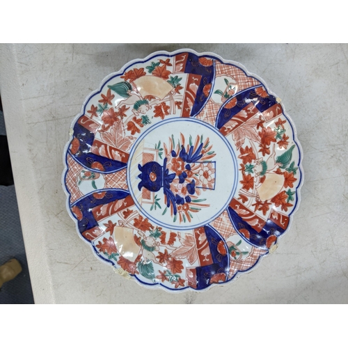 351 - A late Meiji period Japanese Imari charger, along with a pair of Japanese Imari plates A/F Location:... 