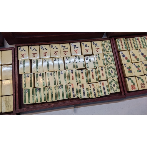 359 - A mid century Mahjong set in a box with five graduated drawers and applied metal mounts
Location:A1F