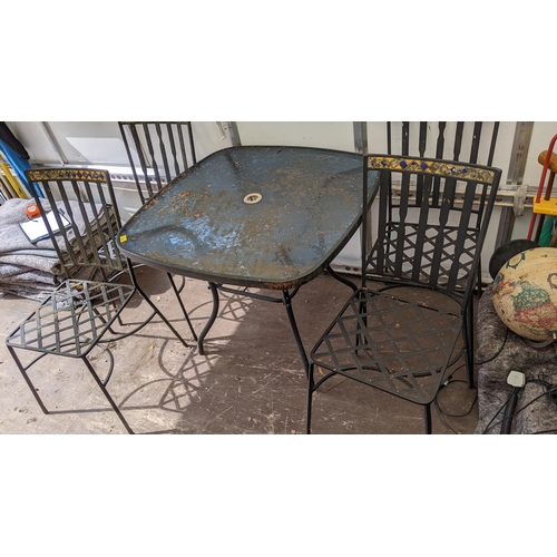 419 - A set of cast iron garden chairs together with a garden table 71.5h x 88.5w
Location: FOYER