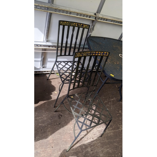 419 - A set of cast iron garden chairs together with a garden table 71.5h x 88.5w
Location: FOYER