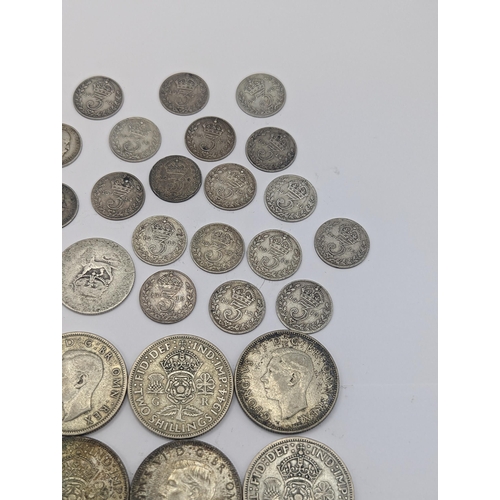 58 - Mixed British coinage to include Edward VII and George V pre 1920 three pence's and shillings along ... 