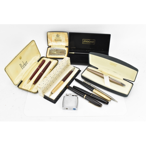 91 - A collection of pens and lighters, to include a Cross matt bronze fountain pen in box, with chrome g... 