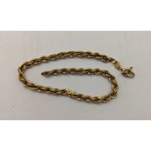 18 - Four 9ct gold bracelets to include two rope twists and a yellow metal enamelled pendant depicting tw... 