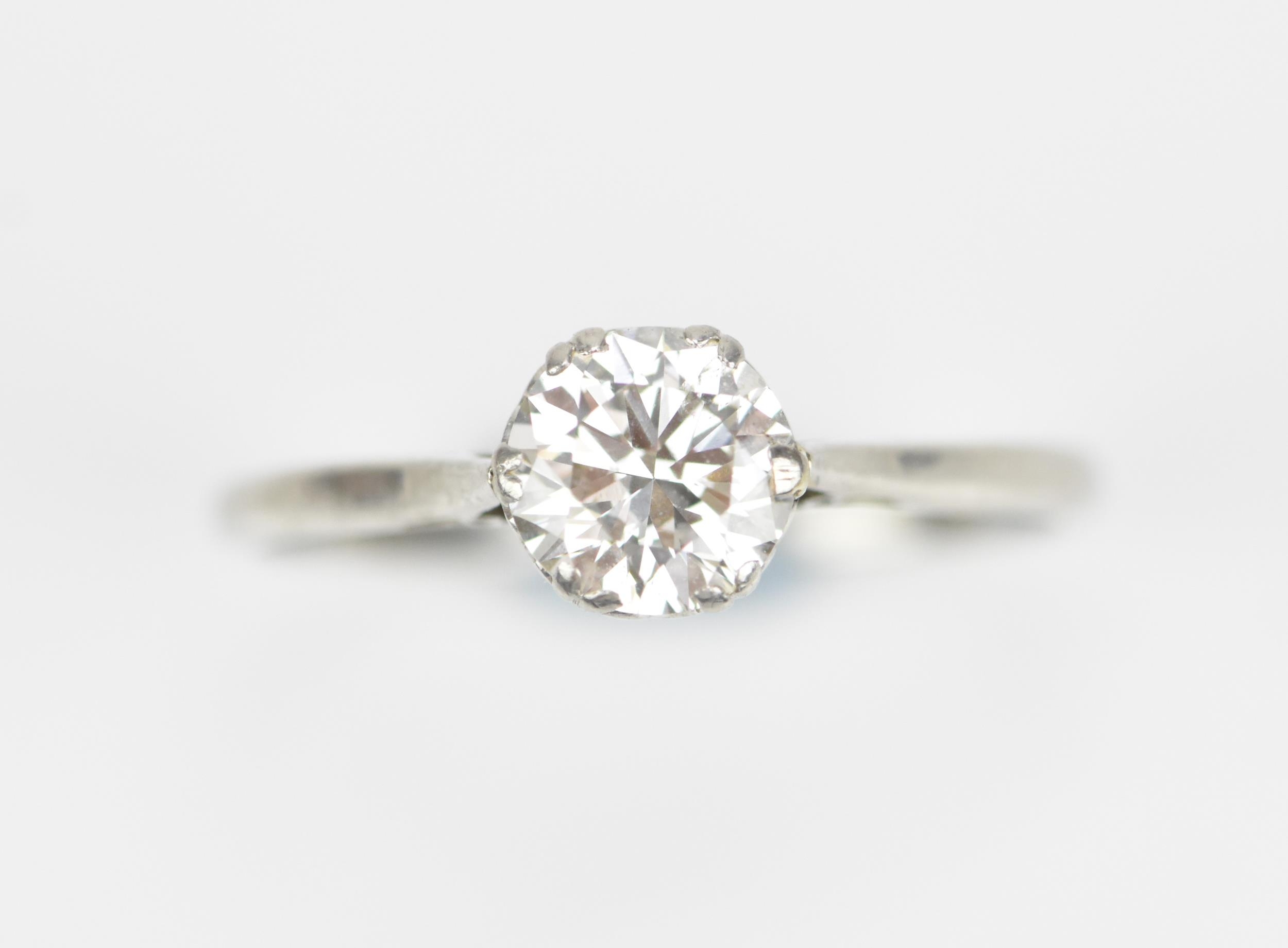 A platinum set diamond solitaire ring, the brilliant cut stone approx 1 ...