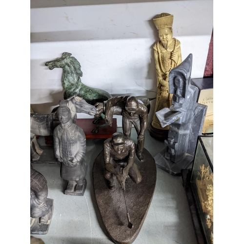 109 - A selection of platinated bronzed composition, resin and metal statues and figurines, terracotta arm... 