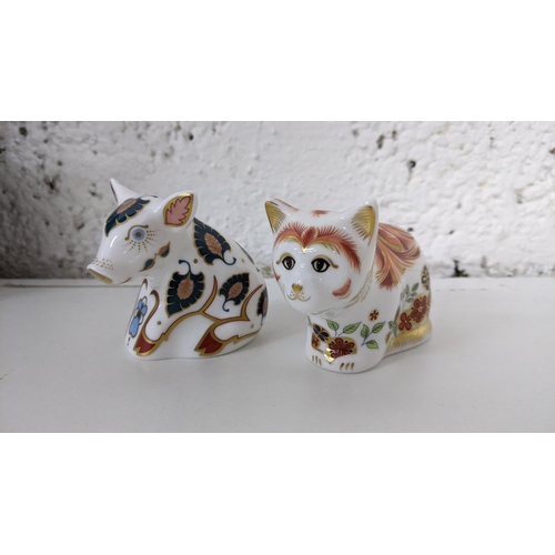 17 - Two boxed Royal Crown Derby collectors guild paperweights to include Spice Kitten and Snuffle Piglet... 